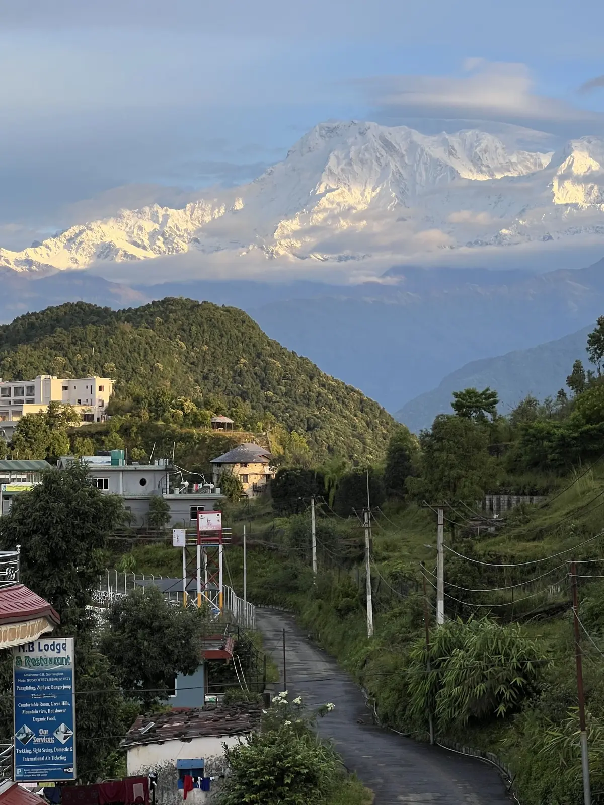 Trail through Sarangkot village with the Annapurna range behind
